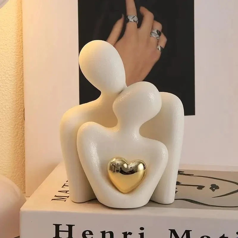 The Embrace Sculpture on a tabletop in ivory