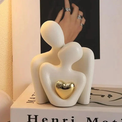 The Embrace Sculpture on a tabletop in ivory