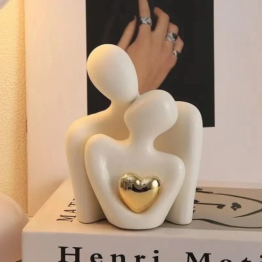 The Embrace Sculpture on a tabletop in ivory